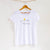Camiseta blanca de mujer, de algodón orgánico y estampado a mano con tintas ecológicas. Serigrafía en color negro y amarillo.